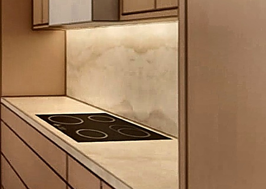 Honed quartz kitchen counters with waterfall island